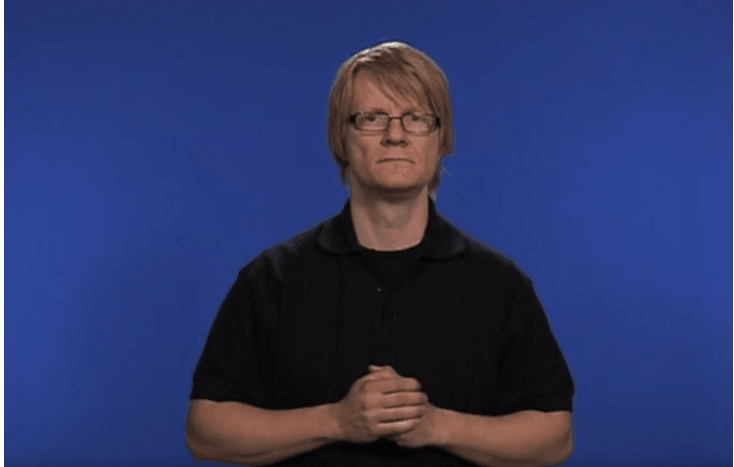 Rörlig bild med person som gör tecknet för välkommen.